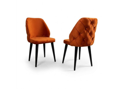 Gepolsterter Holzstuhl orange Chesterfield auf schwarzen Beinen das Esszimmer