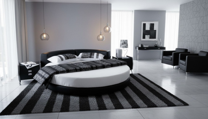 Schwarzes rundes Bett mit modernem Design, eleganten Details und Sofa