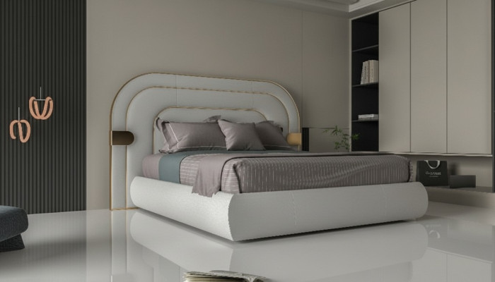 Luxuriöses graues Bett mit goldenen Akzenten im modernen Design und gepolstertem Kopfteil