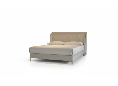 Modernes luxuriöses Bett in grauer Farbe mit elegantem goldenen Kopfteil